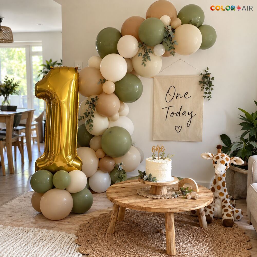 Boho first birthday balloon garland with a giant gold number one
